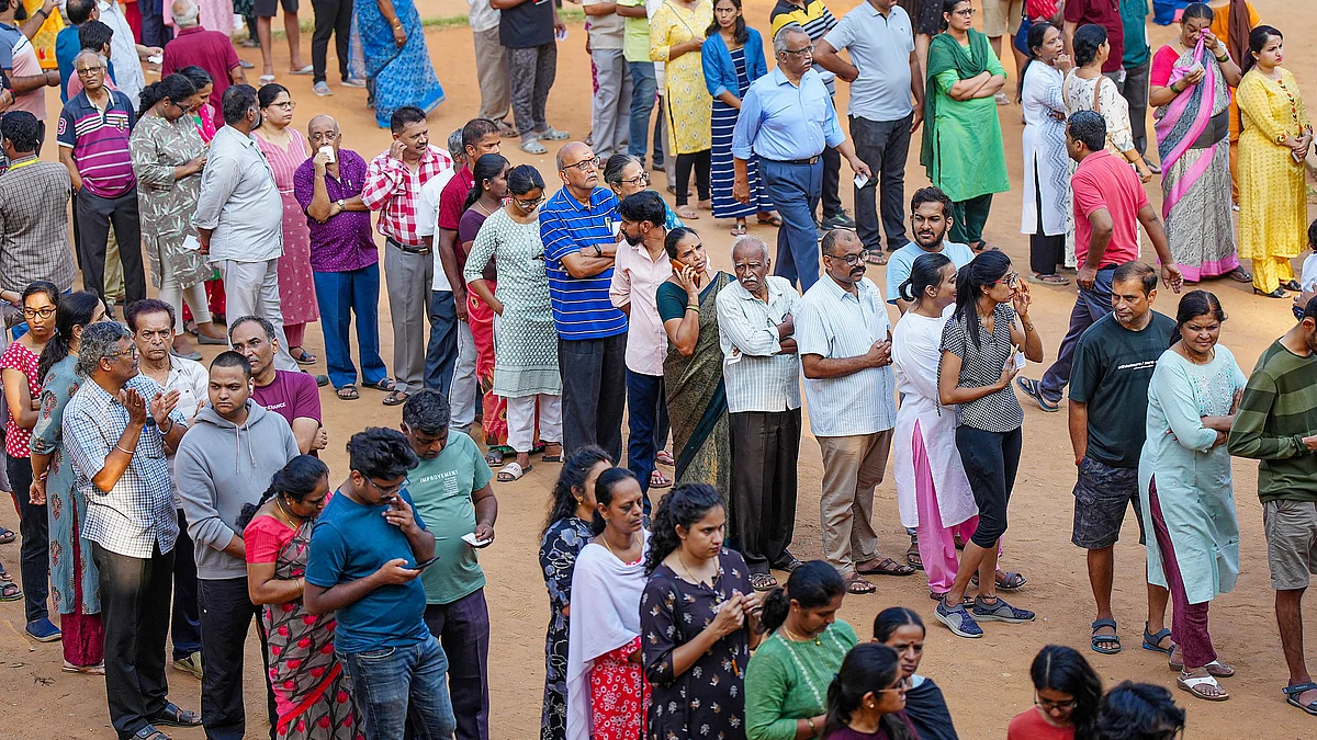 Representative image of people waiting in queues to vote (photo: PTI)