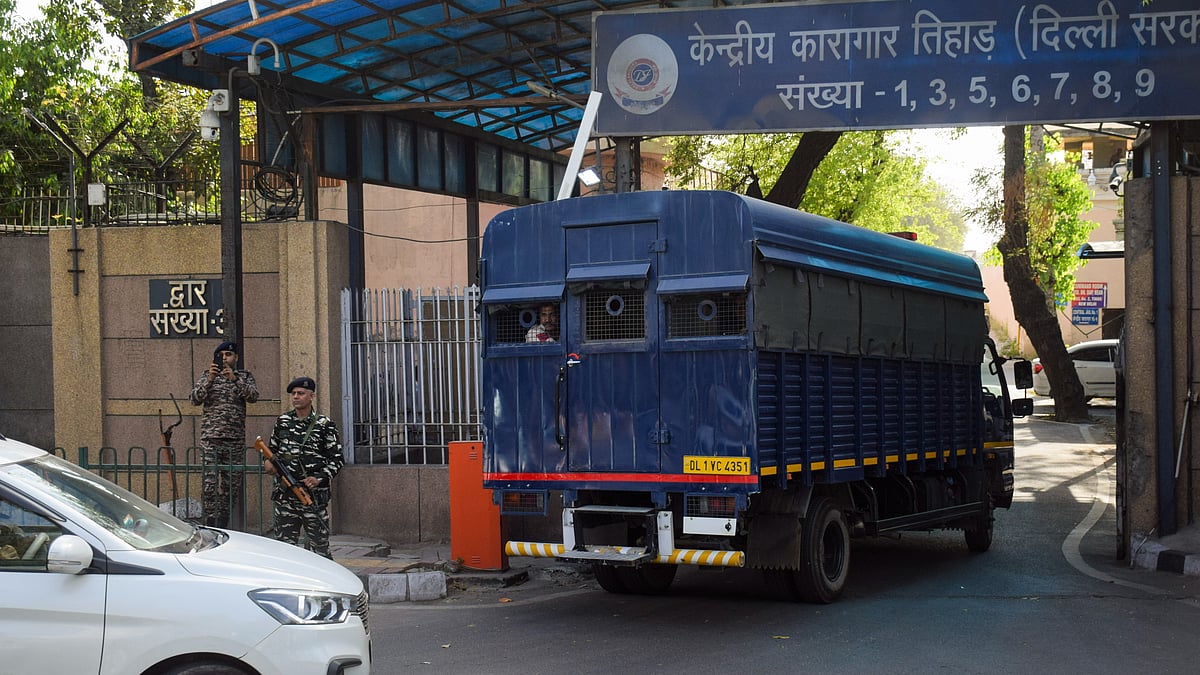 Delhi Chief Minister Arvind Kejriwal being taken to the Tihar Jail in New Delhi on 1 April (photo: PTI)