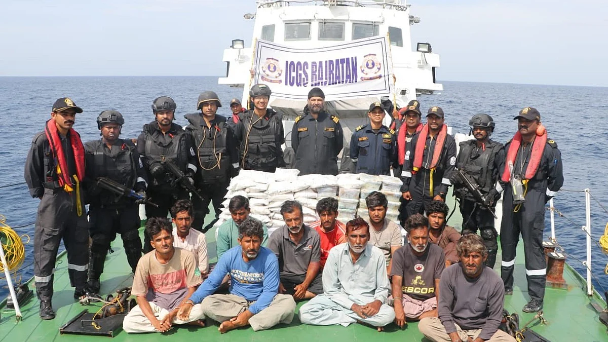 The apprehended Pakistani fishing boat at Porbandar with 14 crew and  86  Kg heroine (Photo: @IndiaCoastGuard)
