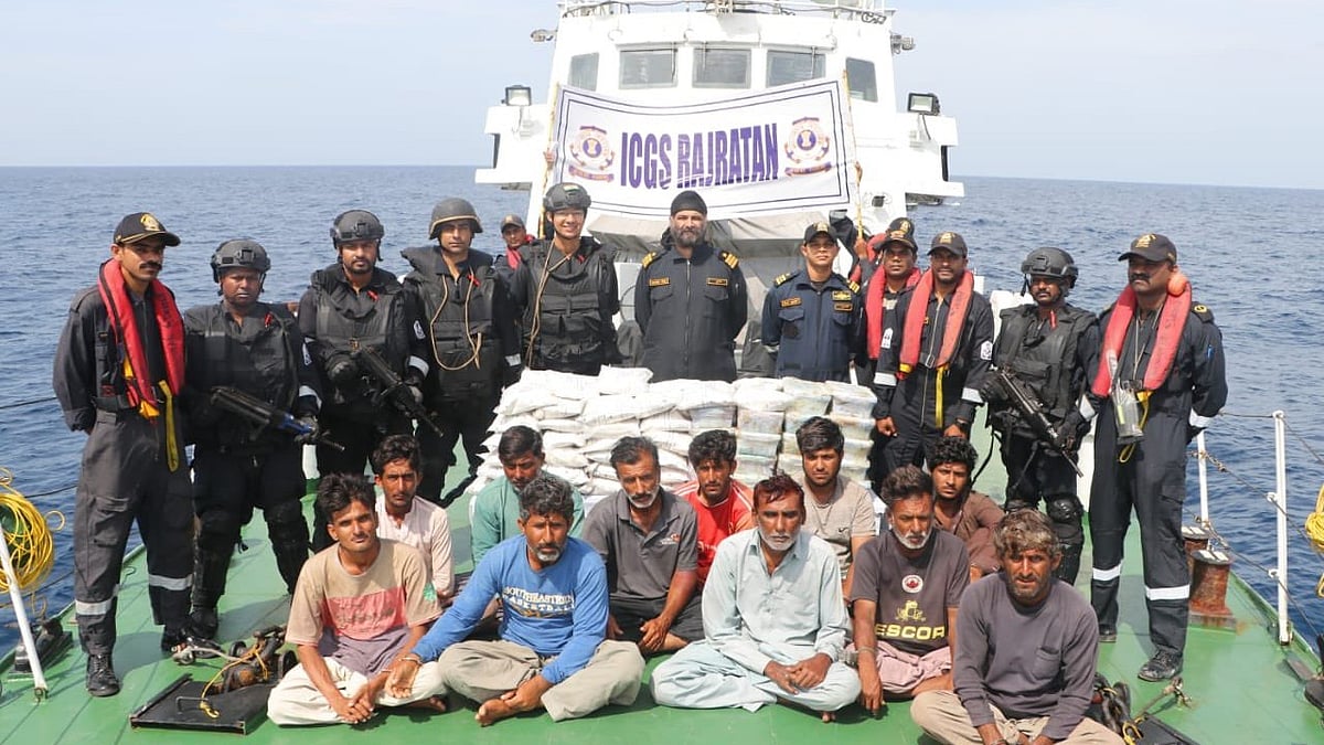 The apprehended Pakistani fishing boat at Porbandar with 14 crew and  86  Kg heroine (Photo: @IndiaCoastGuard)
