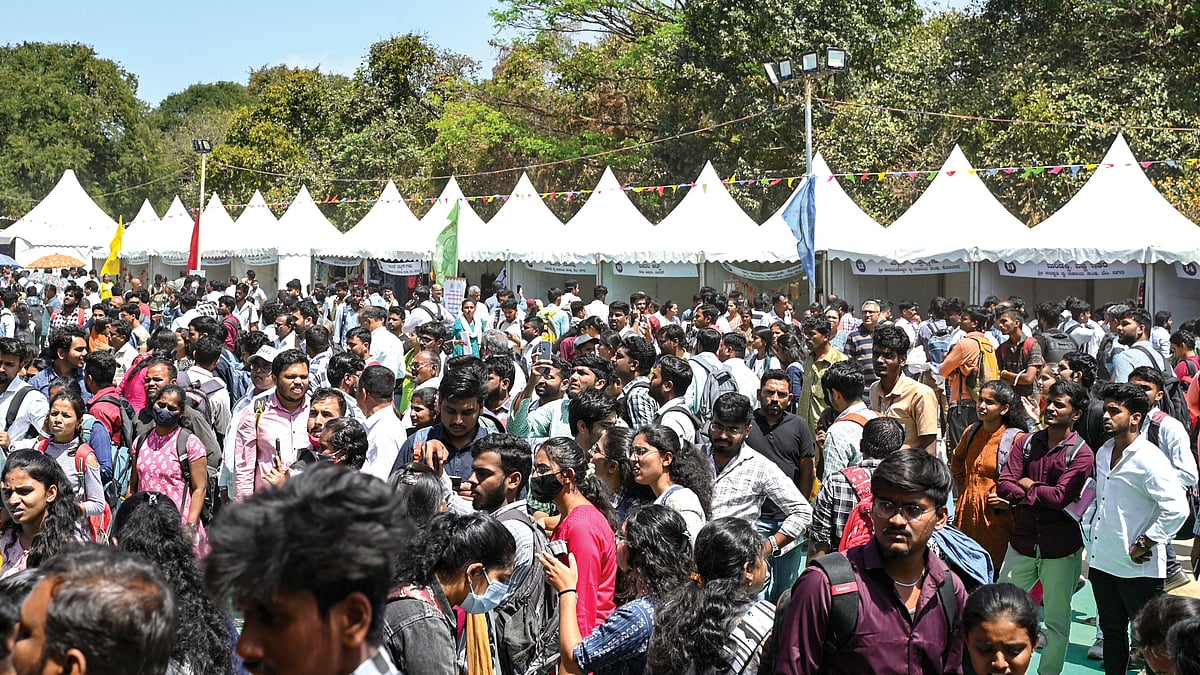 Unemployed youth crowd a walk-in interview counter at a job fair organised by the Karnataka state government in Bengaluru, 26 February 2024 (photo: Getty Images)