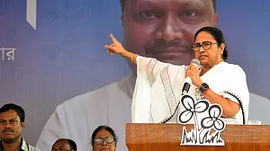 TMC supremo Mamata Banerjee addresses an election campaign rally in Cooch Behar on 5 April (photo: PTI)