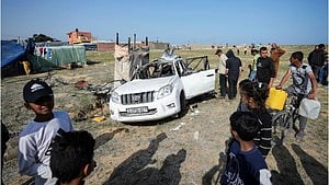 A car damaged in the attack (photo: IANS)