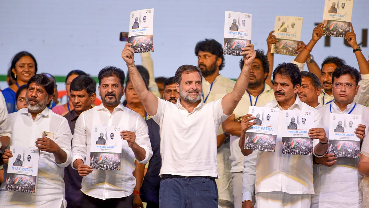 Congress leader Rahul Gandhi with Telangana Chief Minister Revanth Reddy releases the party's manifesto during a public meeting in Hyderabad, Saturday, 6 April (photo: PTI)