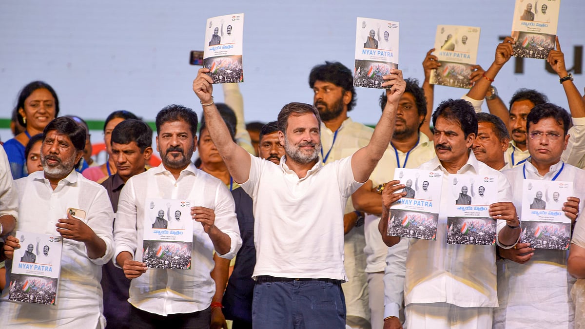 Congress leader Rahul Gandhi with Telangana Chief Minister Revanth Reddy releases the party's manifesto during a public meeting in Hyderabad, Saturday, 6 April (photo: PTI)