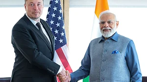 The last time Elon Musk (left) met India's prime minister Narendra Modi (right), he declared himself "a fan of Modi" (photo courtesy @VivekSi85847001/X)