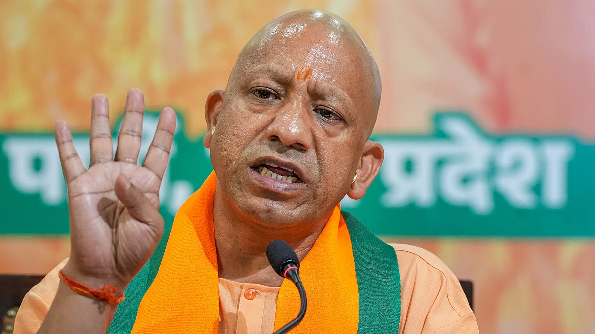 Yogi Adityanath addresses a press conference in Lucknow on 24 April (photo: PTI)