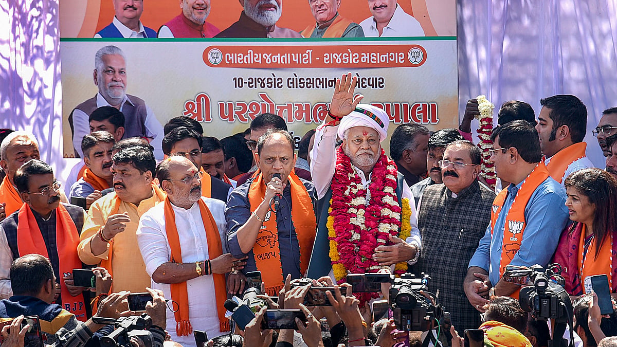 BJP candidate Parshottam Rupala during a roadshow in Rajkot on 5 March (photo: PTI)