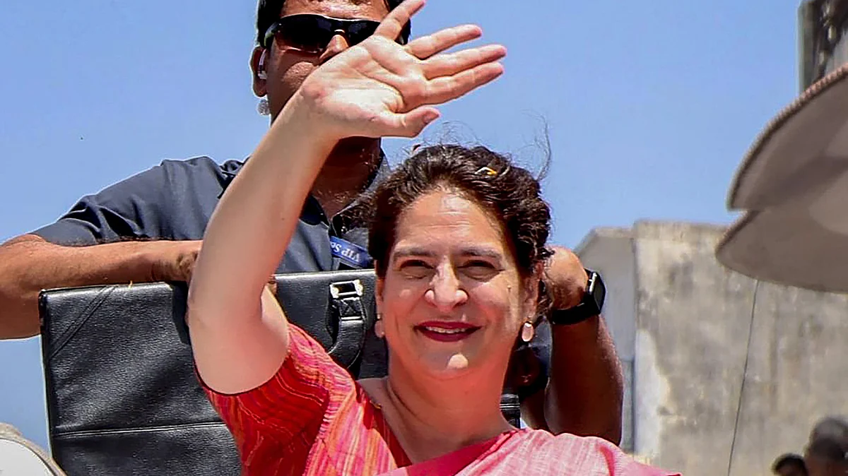 Congress leader Priyanka Gandhi Vadra waves at supporters during a roadshow in Saharanpur on 1 April (photo: PTI)