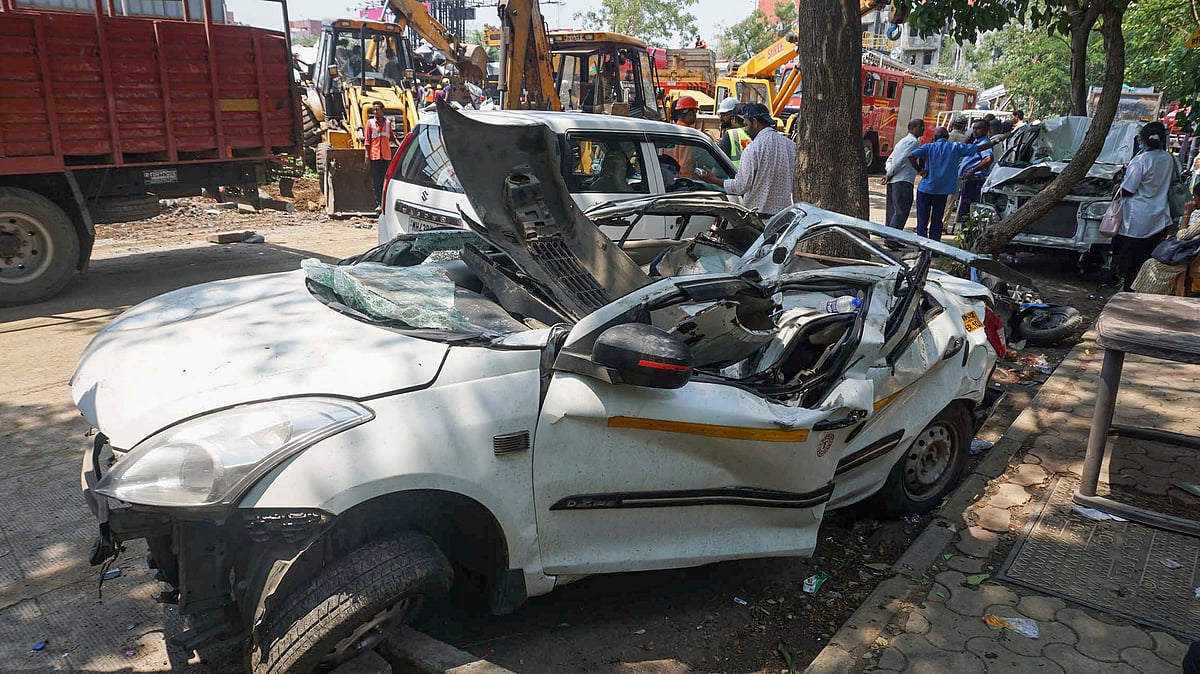 Vehicles damaged after the giant hoarding collapsed at Ghatkopar on 13 May (photo: PTI) 
