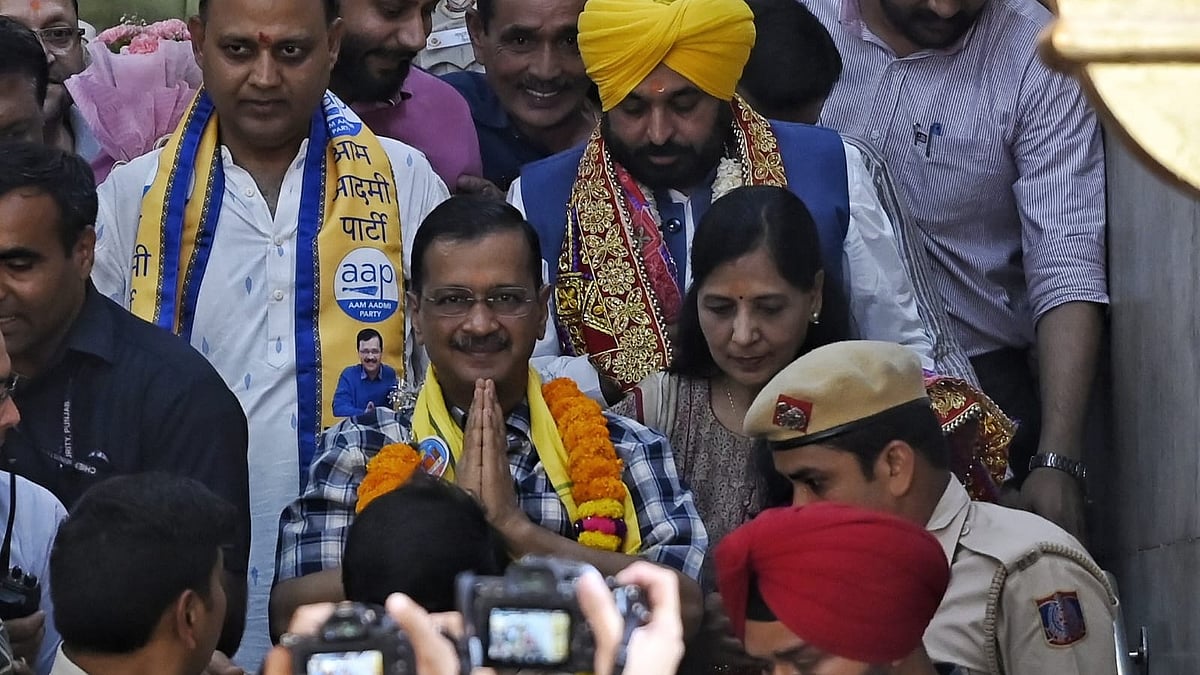 Arvind Kejriwal, Bhagwant Mann and Sunita Kejriwal in New Delhi on 11 May
