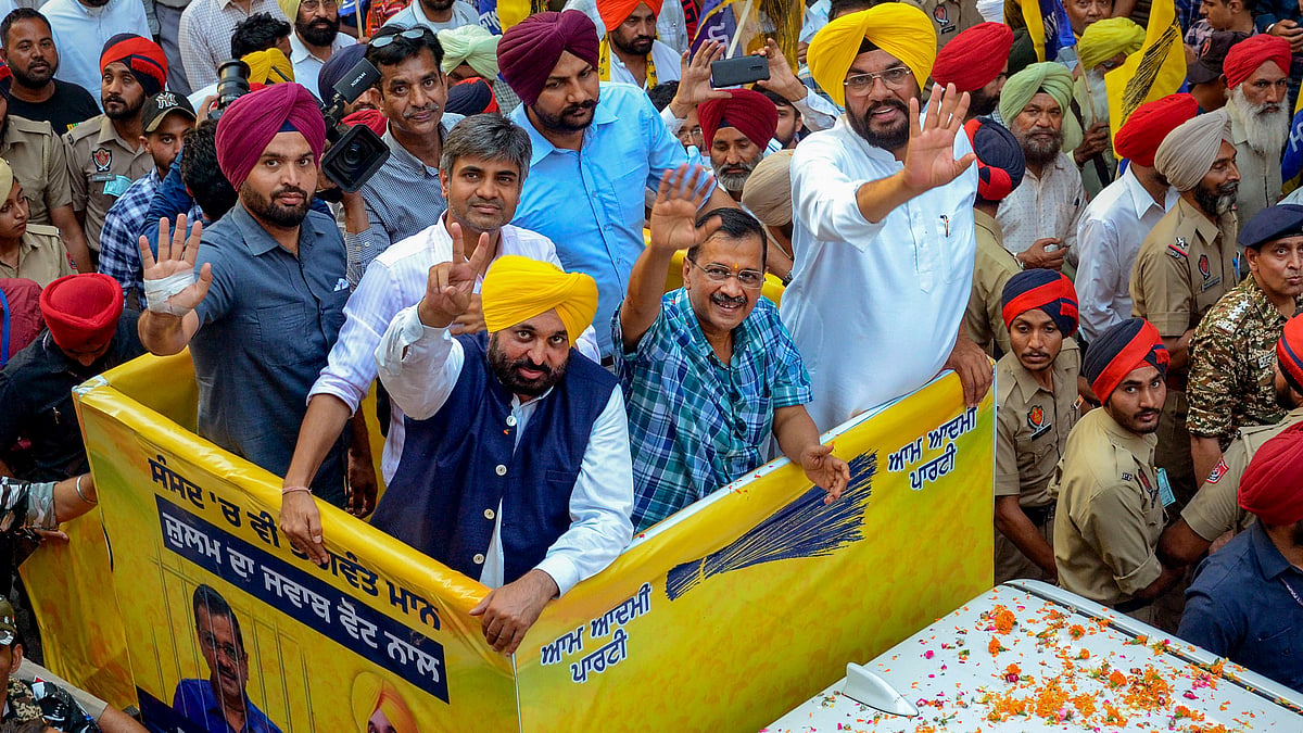 AAP chief Arvind Kejriwal and Punjab CM Bhagwant Mann during a roadshow in Amritsar