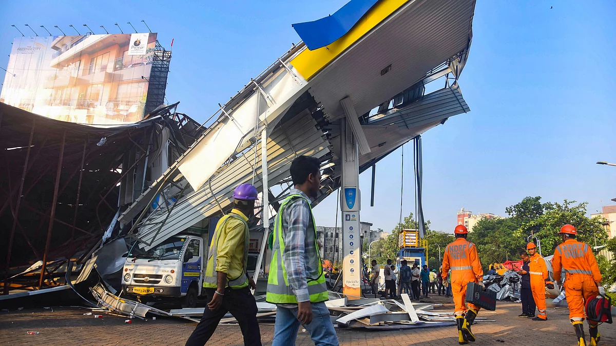 Rescue and relief work underway at Ghatkopar in Mumbai on 14 May (photo: PTI)
