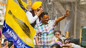 Delhi CM Arvind Kejriwal and Punjab CM Bhagwant Mann at an AAP roadshow in Delhi (photo: PTI)
