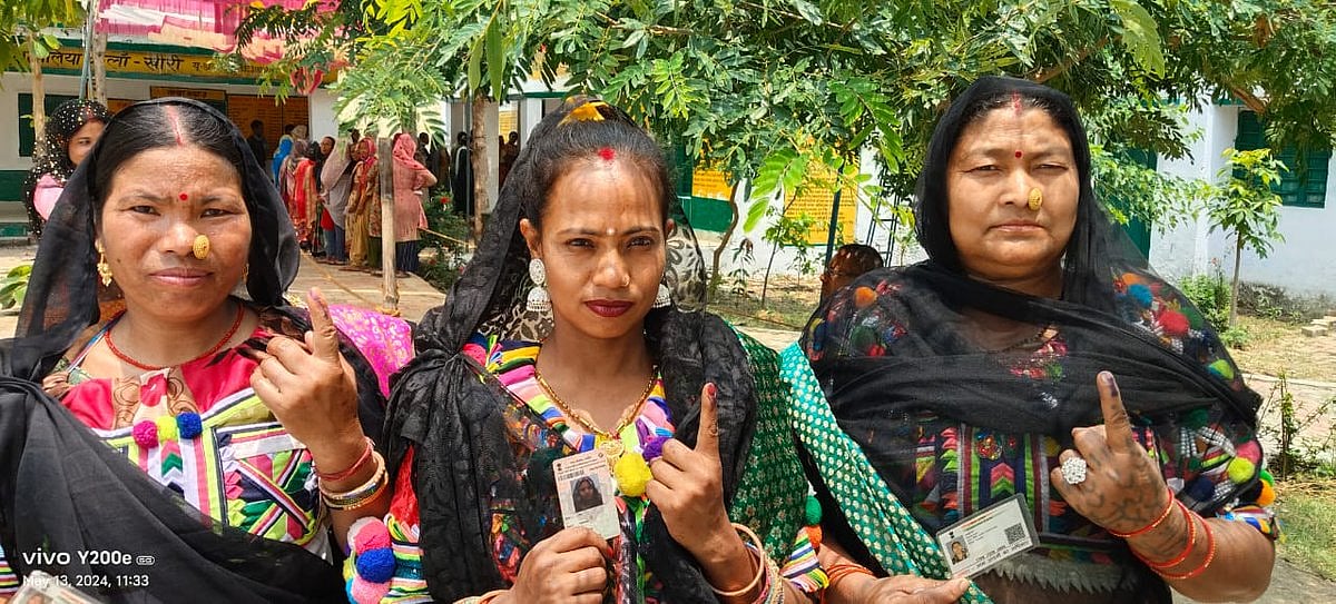 Tharu community women show off their inked index fingers in Lakhimpur (photo courtesy @ECISVEEP/X)