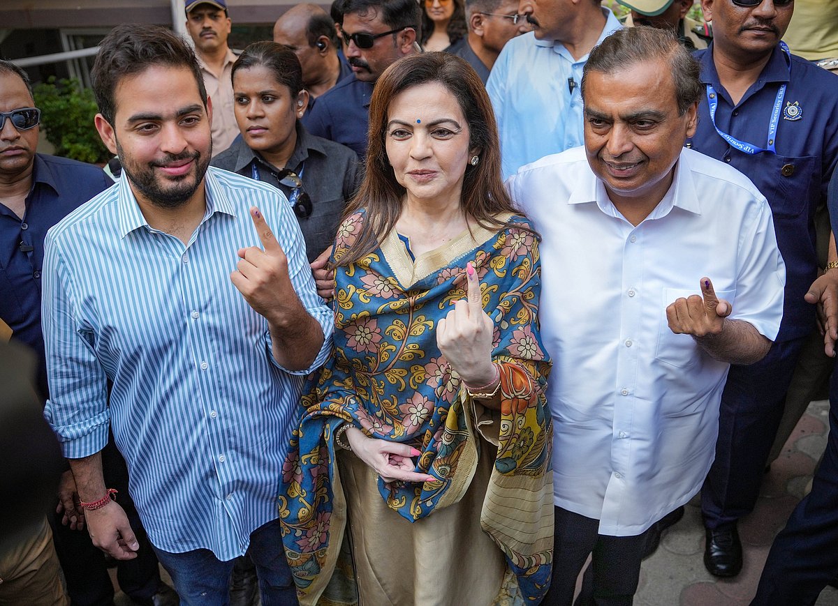 Industrialist Mukesh Ambani with wife Nita and son Akash at a polling booth in Mumbai