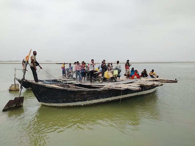 Voters cross the river Kosi in Bihar to exercise their franchise in the third phase of polling (photo courtesy @ECISVEEP/X)