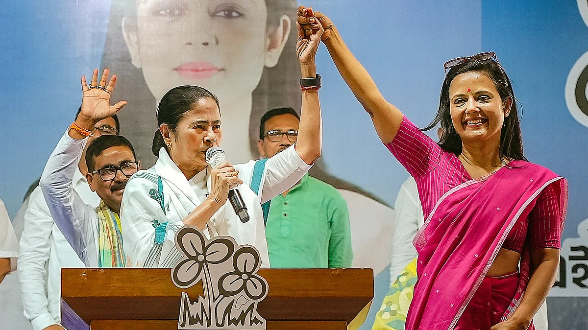 West Bengal CM Mamata Banerjee with TMC candidate Mahua Moitra at a meeting in Nadia (photo: PTI)