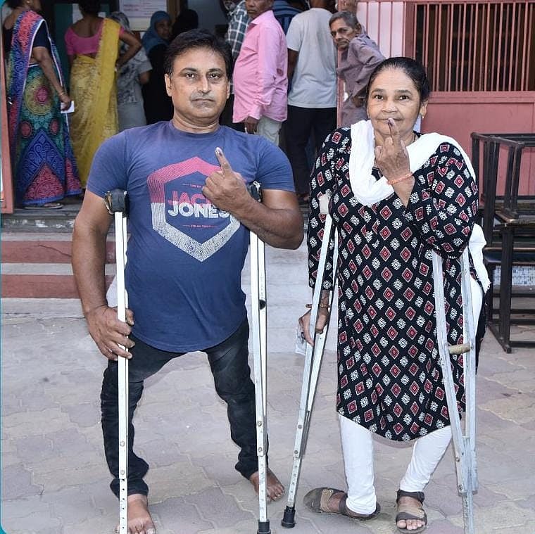 A disabled couple who voted in Gujarat (photo courtesy @ECISVEEP/X)
