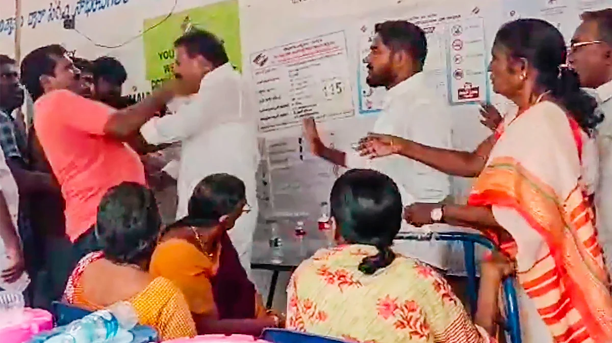 A video screengrab of YSRCP MLA A. Shiva Kumar scuffling with a voter in Tenali, Andhra Pradesh