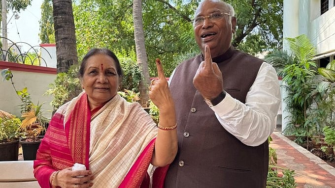 Kharge arrived at the polling booth with his wife Radhabai Kharge and exercised his franchise (photo: @kharge/X)