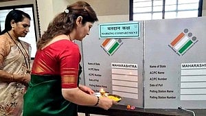 Rupali Chakankar performs EVM ‘pooja’ at the Baramati Lok Sabha constituency on 7 May (photo: IANS) 