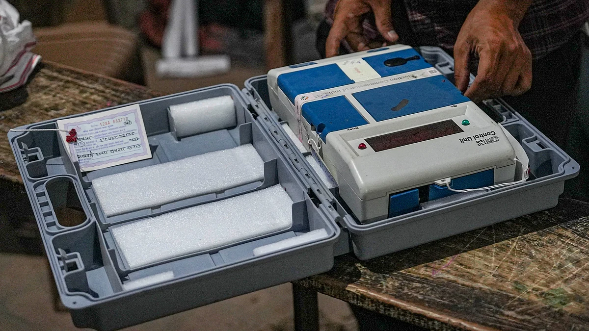 A polling official prepares to seal the EVM after the voting in Uttar Pradesh on 7 May (photo: PTI)
