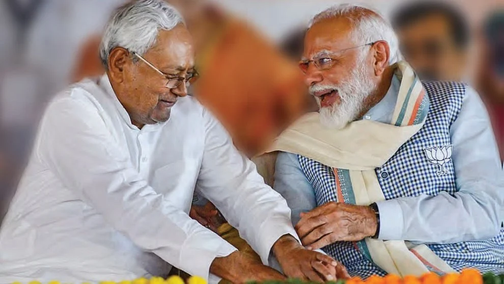 Nitish Kumar reaches for Prime Minister Modi’s feet at a rally in Bihar's Nawada on 7 April 2024