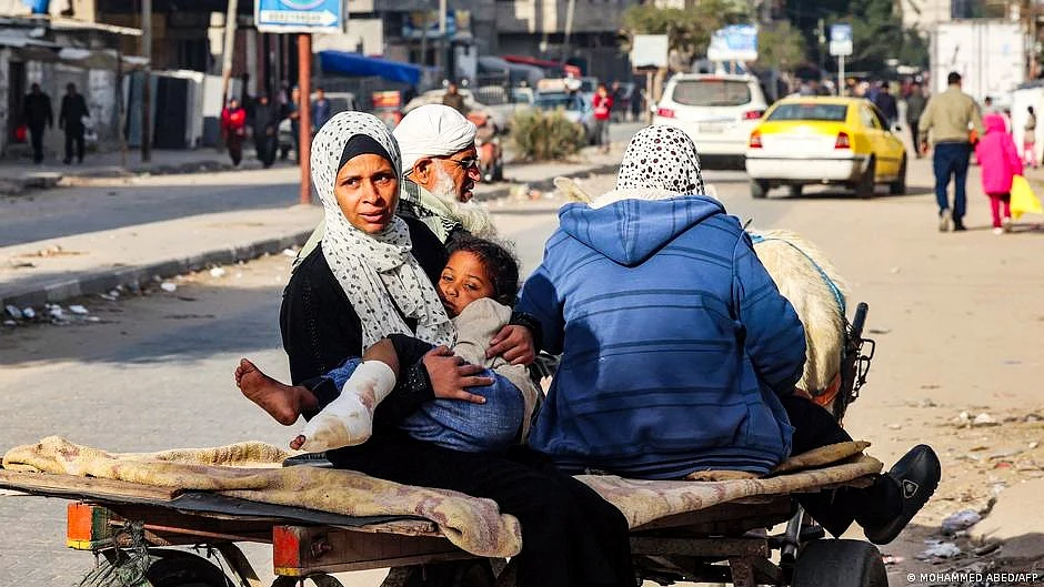 File photo of a family on a horse-drawn cart with an injured child in Rafah
