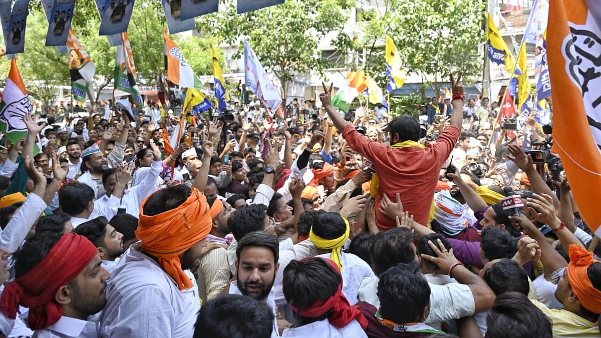 Fans jostle for a glimpse of their youth leader