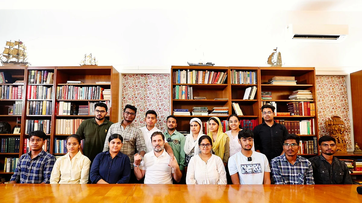 Rahul Gandhi (centre) with NEET aspirants (photo: @INCIndia/X)