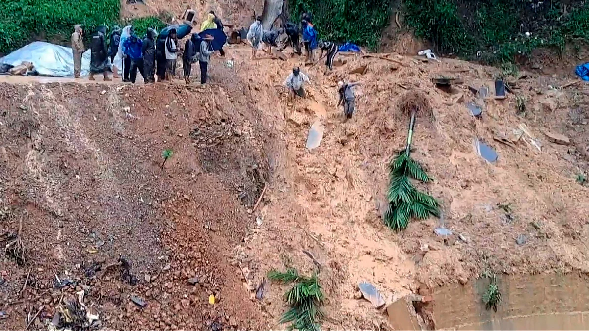 NDRF and SDRF officials carry out a rescue operation in Aizawl on 30 May (photo: PTI)