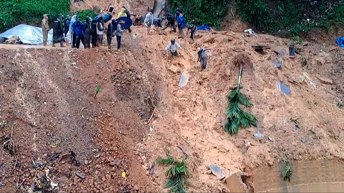 NDRF and SDRF officials carry out a rescue operation in Aizawl on 30 May (photo: PTI)