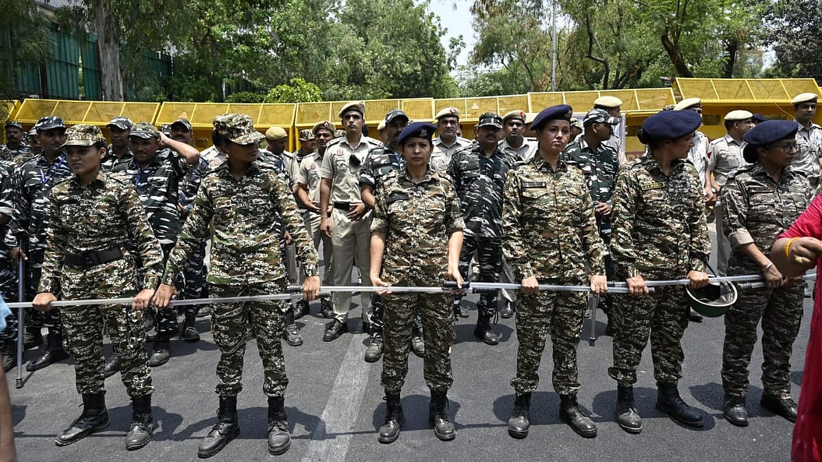 Policemen and security personnel stand guard