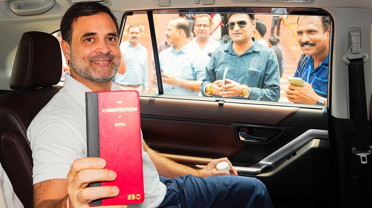 Congress MP Rahul Gandhi holds a copy of the Indian Constitution (photo: PTI)
