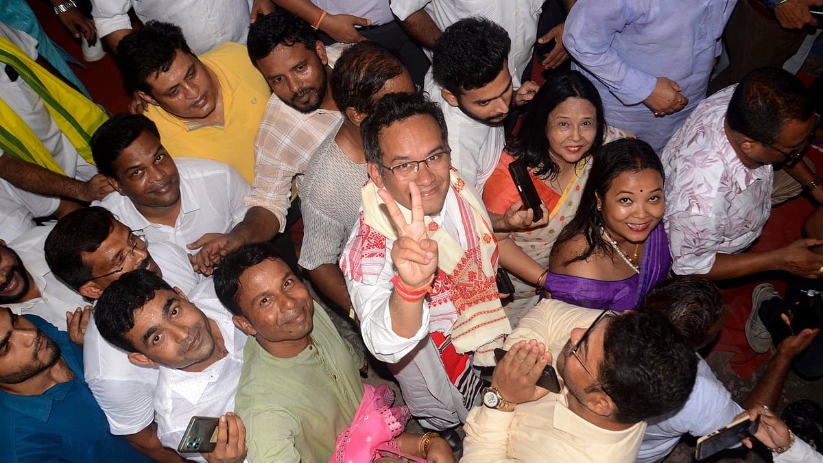 Gaurav Gogoi (in traditional scarf) celebrates his victory from Jorhat, Assam (photo: PTI)