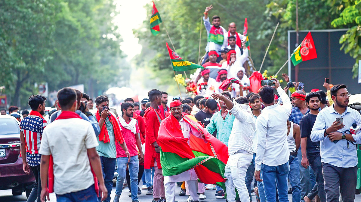 Supporters in Lucknow celebrate the Samajwadi Party's victory in the Lok Sabha elections