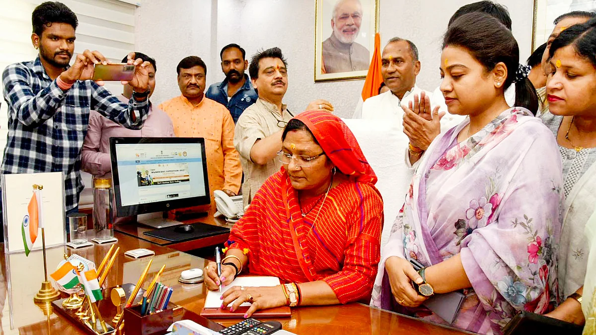 Minister Savitri Thakur assuming office in New Delhi on 11 June (photo: PTI)
