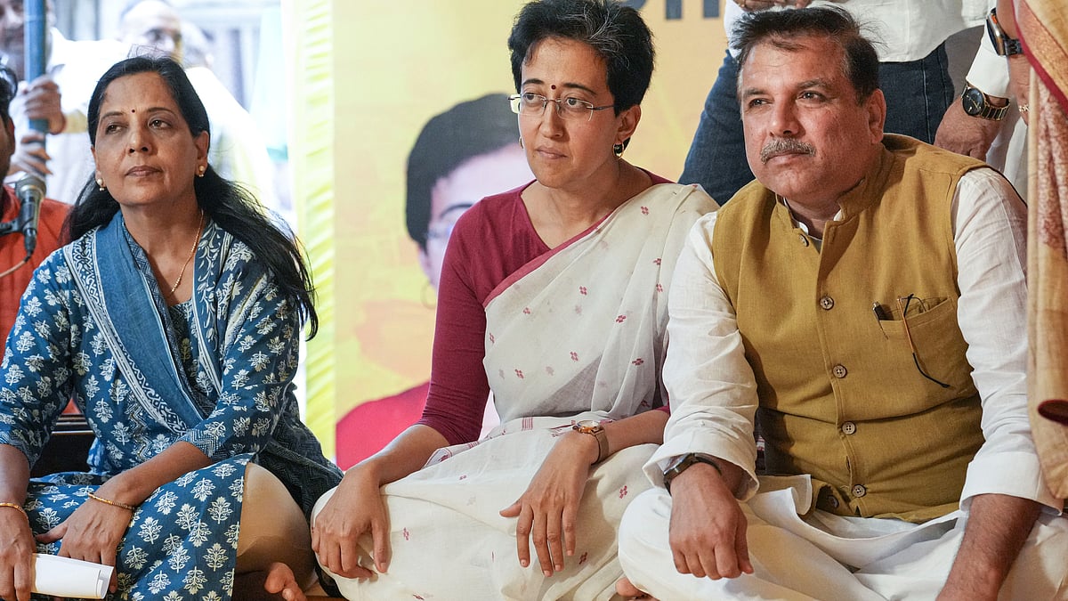 Atishi, Sanjay Singh and Sunita Kejriwal during the hunger strike in New Delhi on 21 June (photo: PTI)