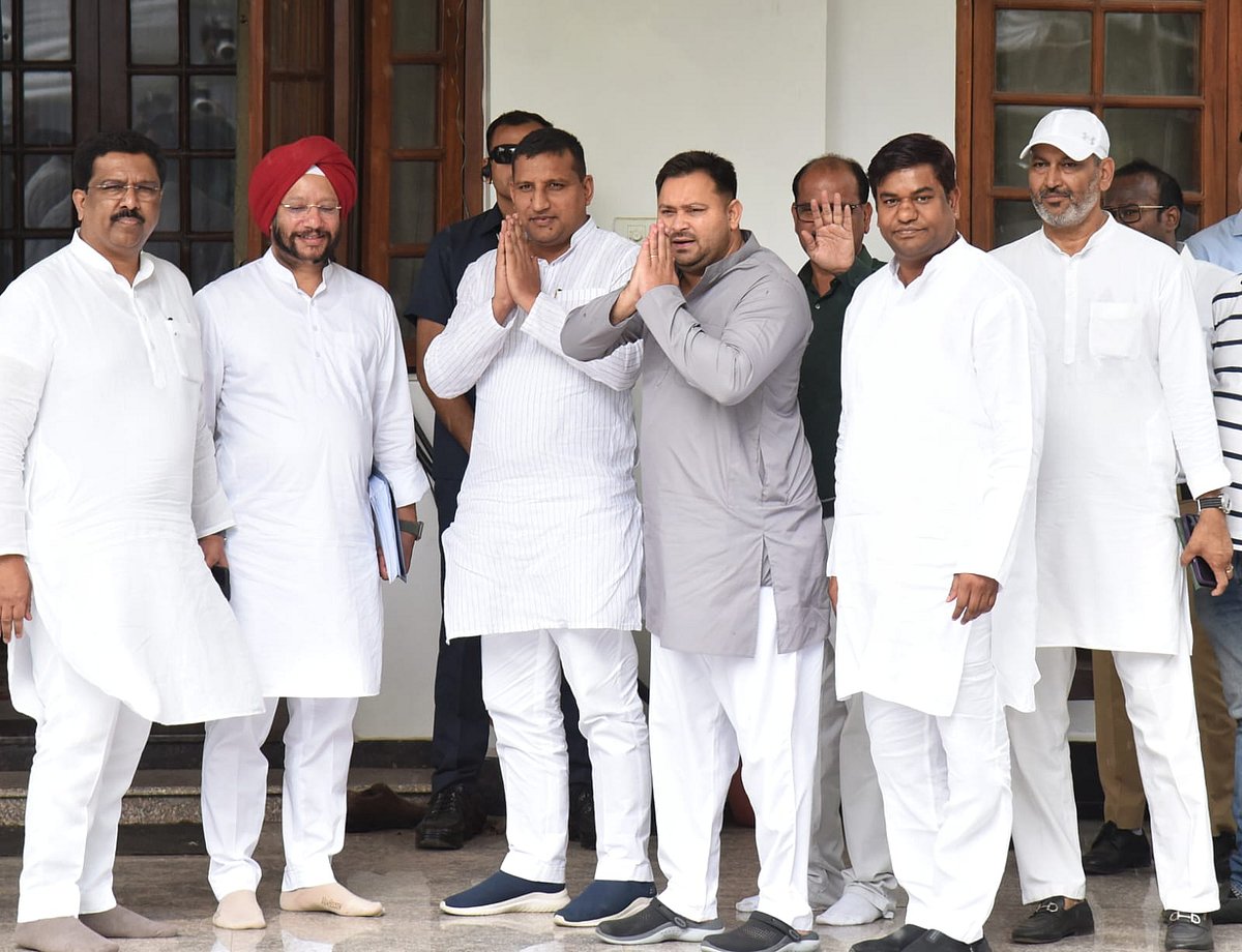 Tejashwi Yadav (grey kurta) of the RJD and leader of the Opposition in the Bihar assembly greets supporters and media