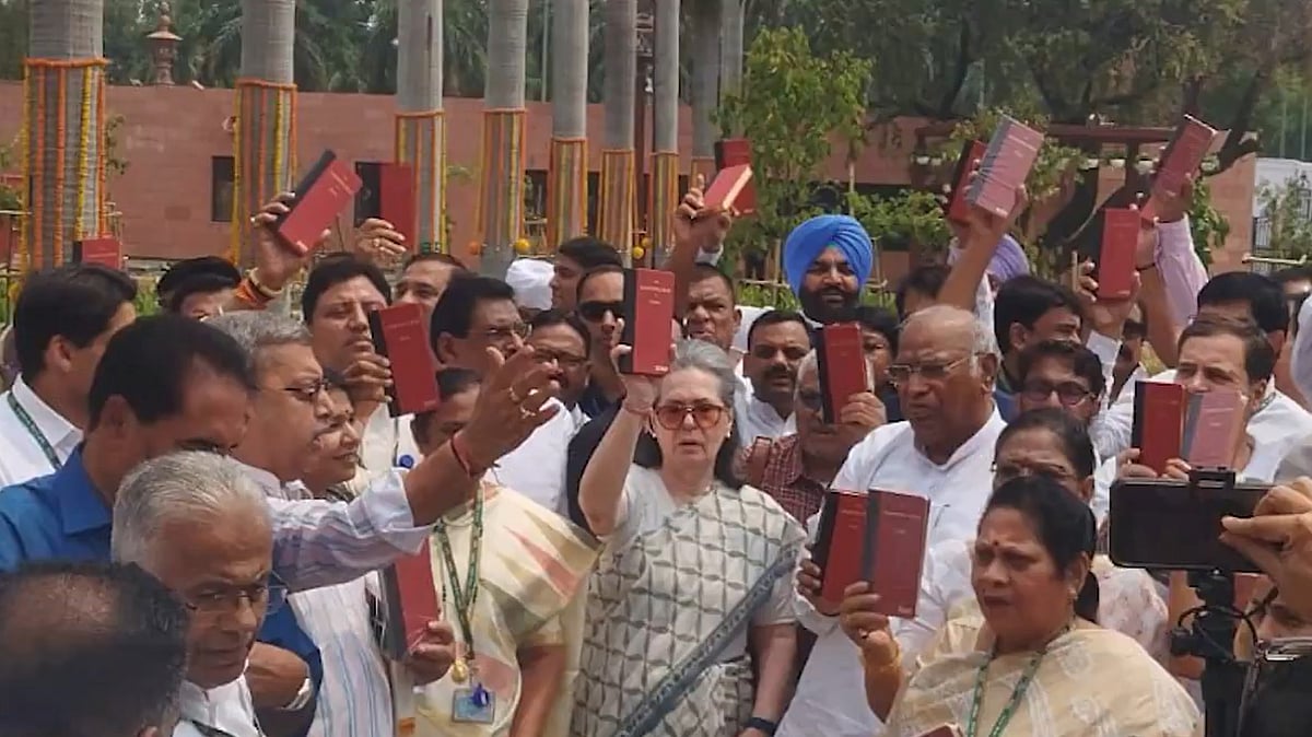 Screengrab of INDIA bloc MPs holding copies of the Constitution in their hands from @kharge/X