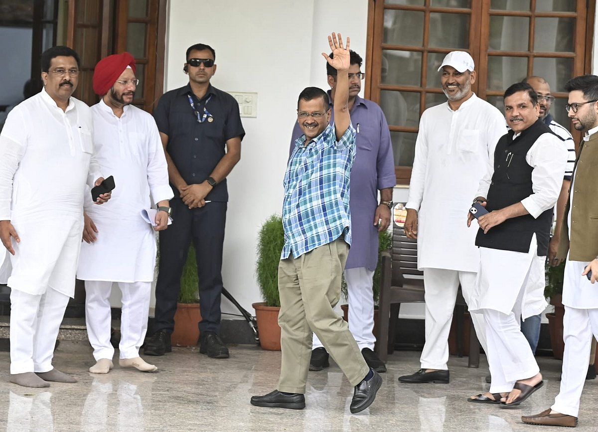 Aam Aadmi Party convenor and Delhi CM Arvind Kejriwal greets the crowd outside. He is on interim bail and must surrender himself tomorrow