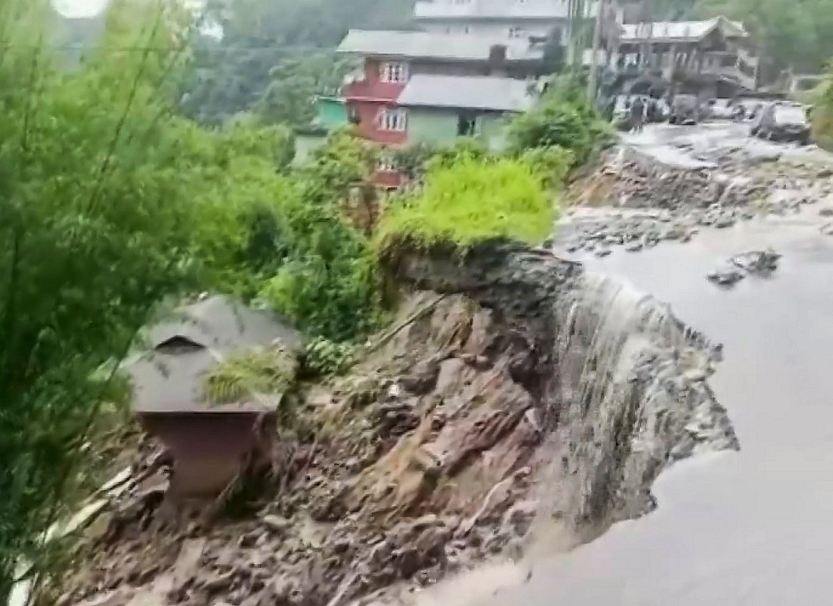 Water floods a road (photo: PTI)