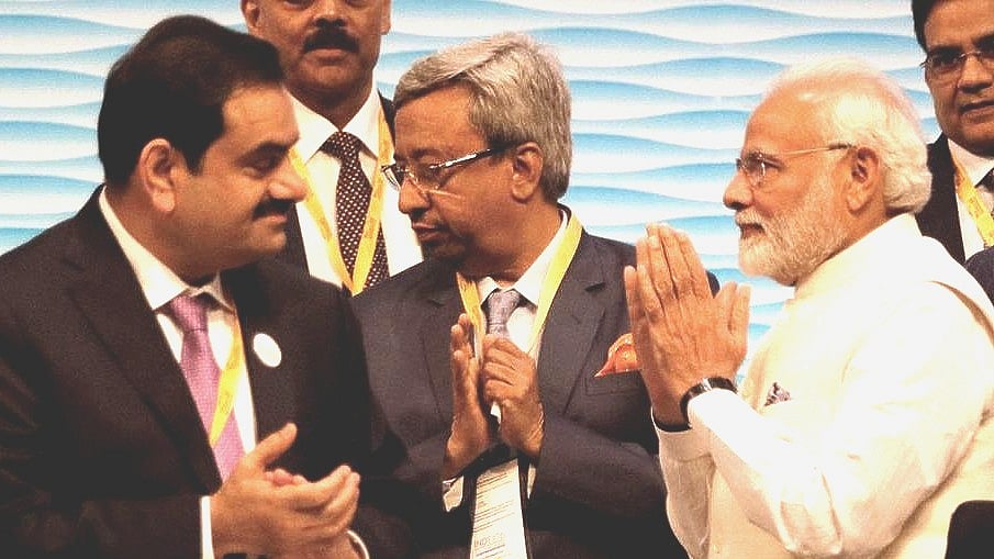 PM Modi greets industrialist Gautam Adani (left)