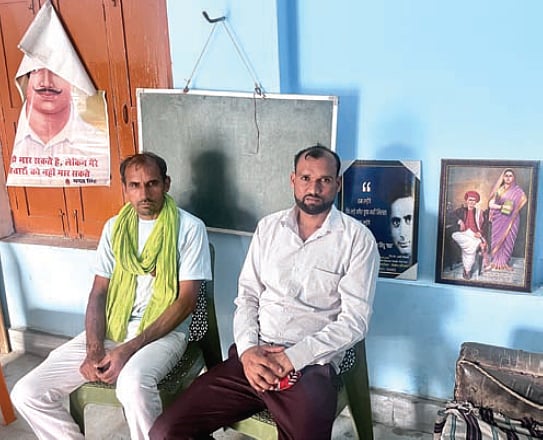 Mahavir Singh (in green gamchha) and Rinku at Ghaso Kalan’s library