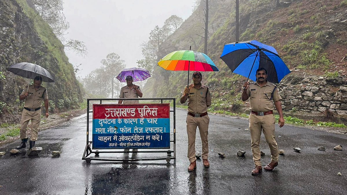 Police personnel stand guard in Nainital on 6 July