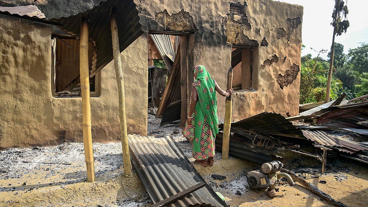 A damaged house in Dhalai district on 13 July (photo: PTI)