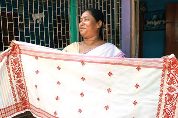 Taru Baruah displays an unsold gamusa