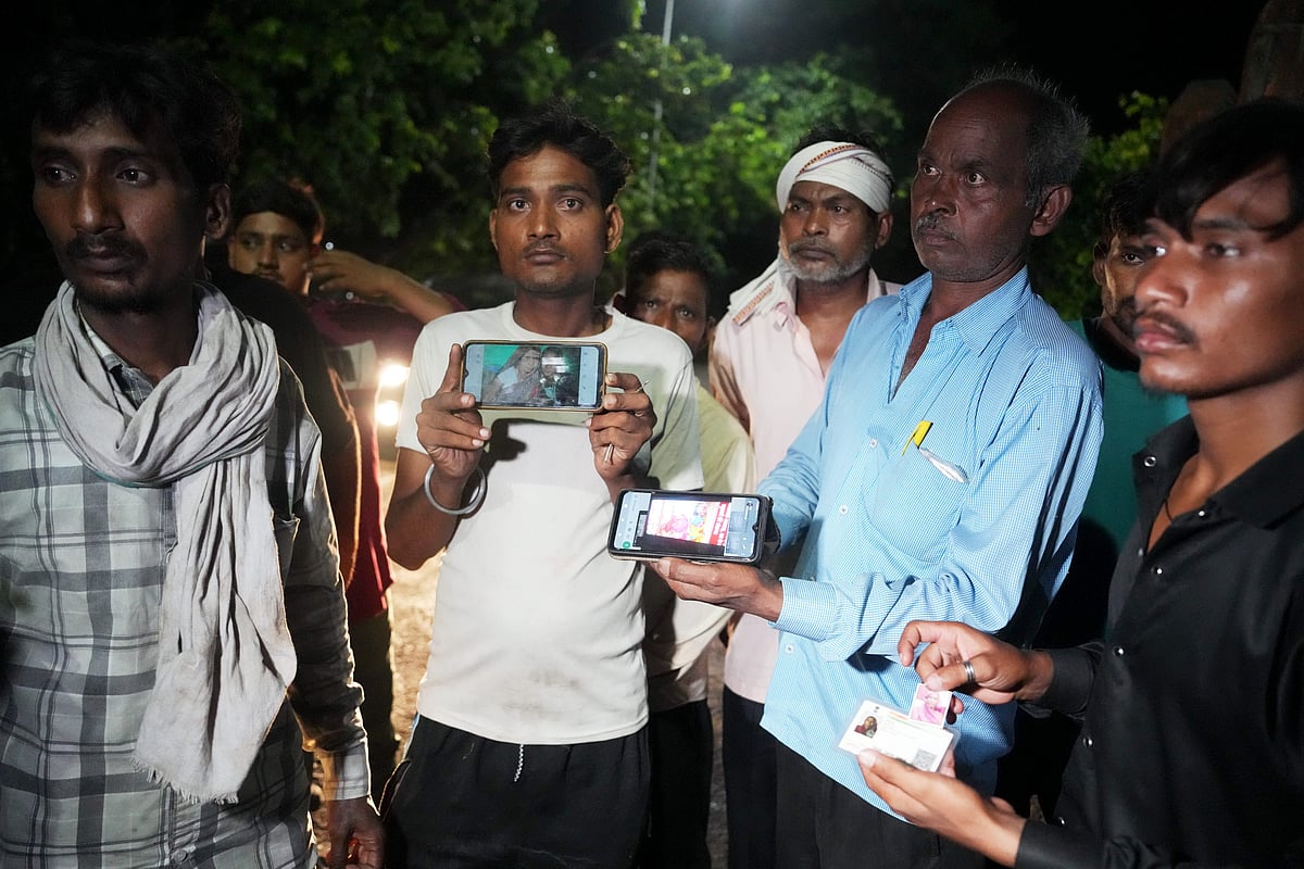 Relatives of victims of the Hathras stampede at Sikandra Rao community health centre in Hathras, 2 July (photo: PTI)