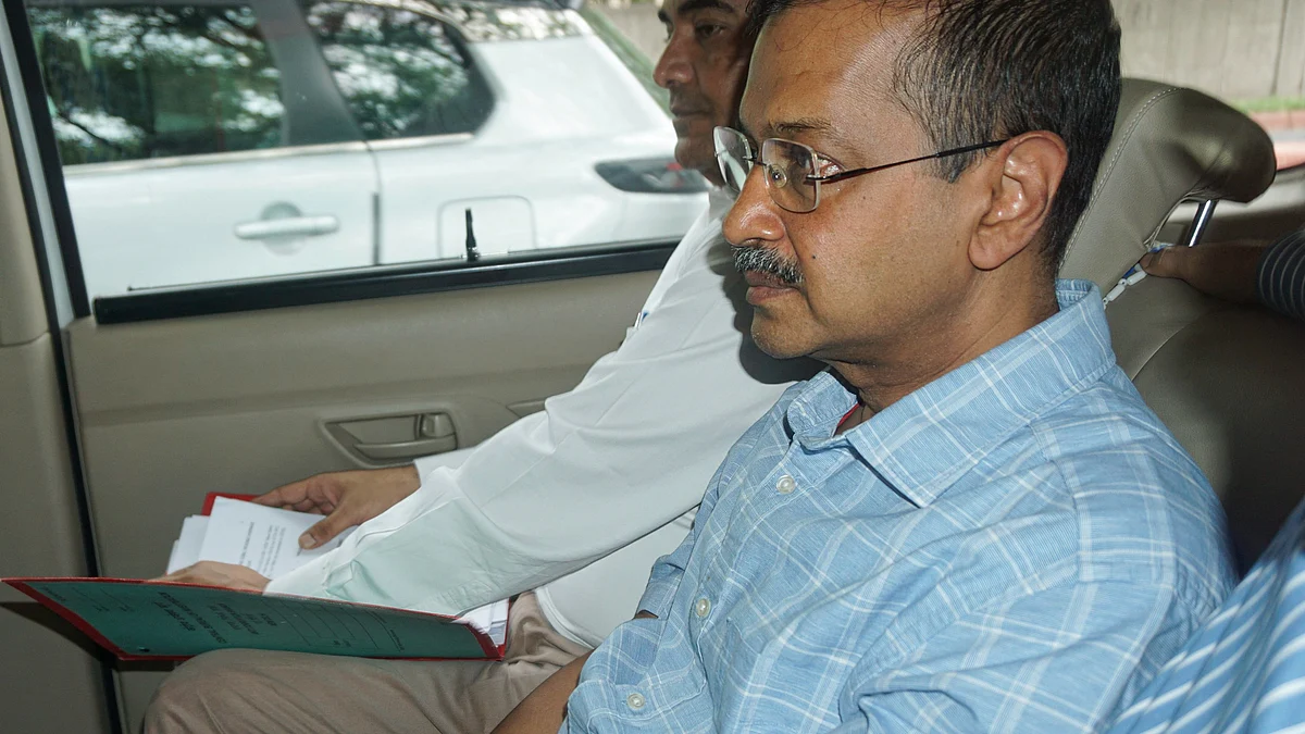 Arvind Kejriwal being taken to the court in New Delhi on 29 June (photo: PTI)